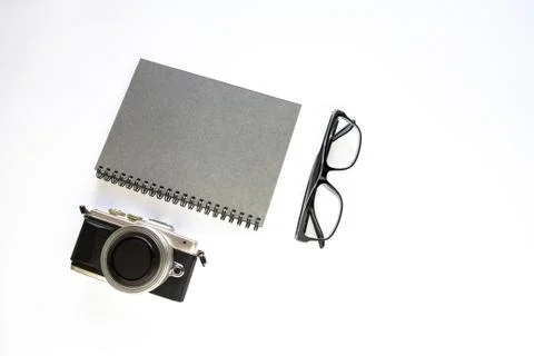 Notebook ,camera and glasses on white background. Stock Photos