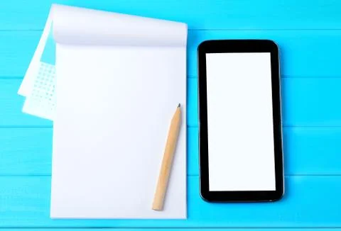 Notebook with cell phone Stock Photos