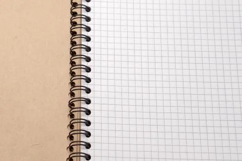 Notebook with checkered sheets. Top view. Close-up Stock Photos