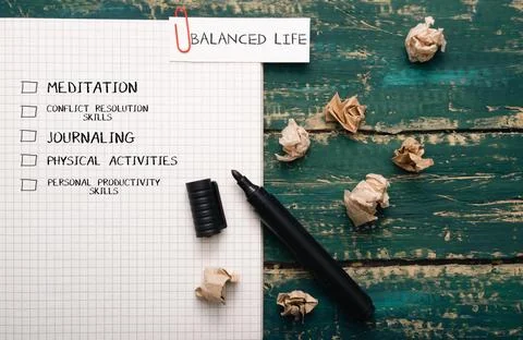 Notebook with checklist for balanced life, featuring meditation, journaling, Stock Photos