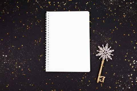Notebook with clean note book and festive golden key Stock Photos