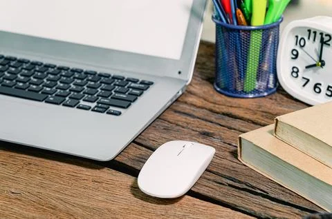 The notebook computer is on the desk Stock Photos