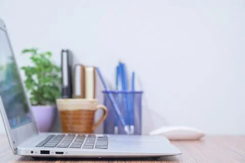Notebook computer was placed at the desk in the room Stock Photos