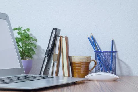 Notebook computer was placed at the desk in the room Stock Photos