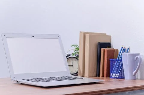 Notebook computer was placed at the desk in the room Stock Photos