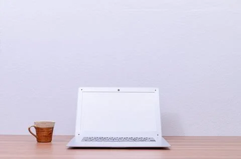 Notebook computer was placed at the desk in the room Stock Photos