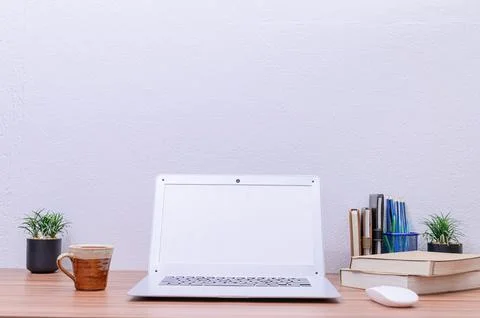 Notebook computer was placed at the desk in the room Stock Photos