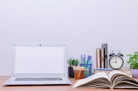 Notebook computer was placed at the desk in the room Stock Photos