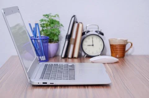 Notebook computer was placed at the desk in the room Stock Photos
