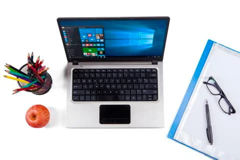 Notebook computer with windows 10 and stationery 스톡 사진