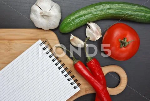Notebook for cooking recipes and vegetables Stock Photos