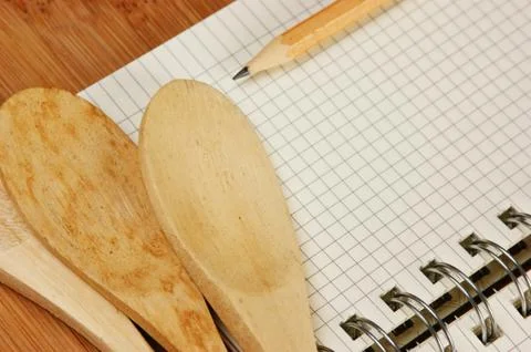 Notebook for culinary recipes on a kitchen cutting board Stock Photos