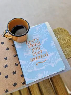 Notebook with a cup of coffee Stock Photos
