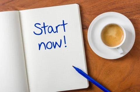 Notebook on a desk - start now Stock Photos
