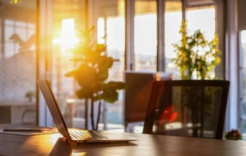 Notebook on desk in sunlight. Stock Photos