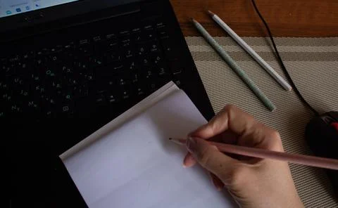 Notebook on the desktop Stock Photos