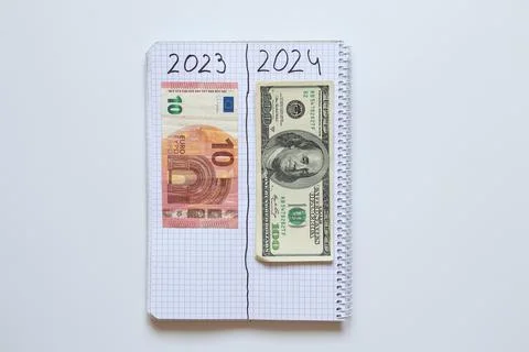 The notebook is divided into two halves, where 2023 and ten euros in the se.. Stock Photos