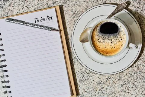 Notebook with to do list and a cup of coffee Stock Photos