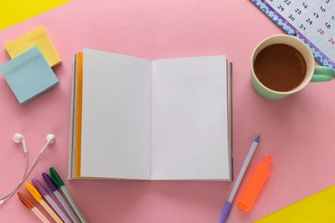 Notebook with to-do-list mockup, coffee mug, pens and sticky notes Stock Photos