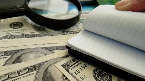 Notebook dollars hands Stock Footage 88140756