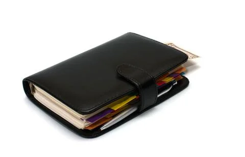 Notebook with dollars. Stock Photos