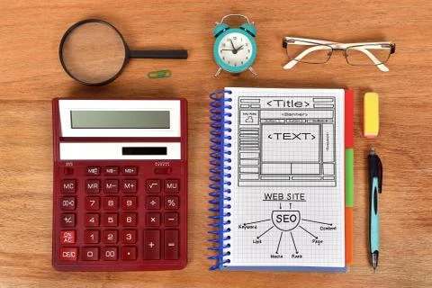 Notebook with drawing web concept and red calculator Stock Photos