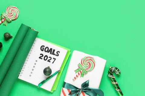 Notebook with empty to do list for 2026 year and Christmas gift on green back Stock Photos