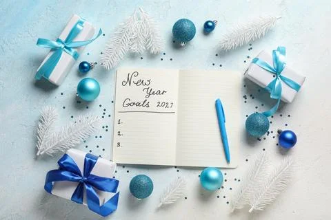 Notebook with empty to do list, Christmas decor and gifts on light blue backg Stock Photos