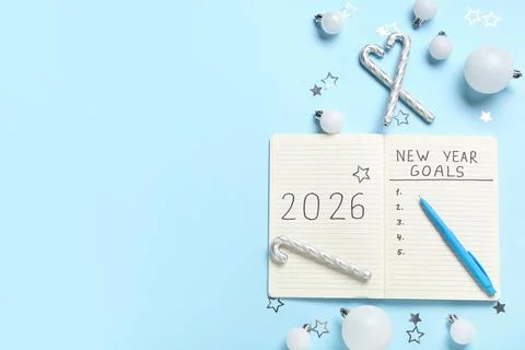 Notebook with empty to do list, pen and Christmas decor on blue background. N Stock Photos