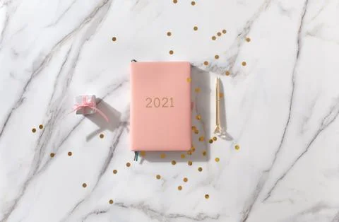 Notebook with empty pages for text, with pen, coffee cup, gift boxes, gold Stock Photos