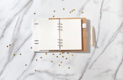 Notebook with empty pages for text, with pen, coffee cup, gift boxes, gold Stock Photos
