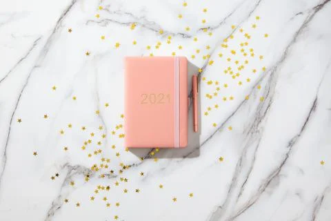 Notebook with empty pages for text, with pen, coffee cup, gift boxes, gold Stock Photos