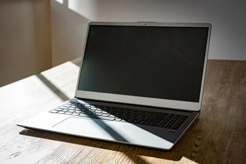 A notebook on an empty wooden table Stock Photos