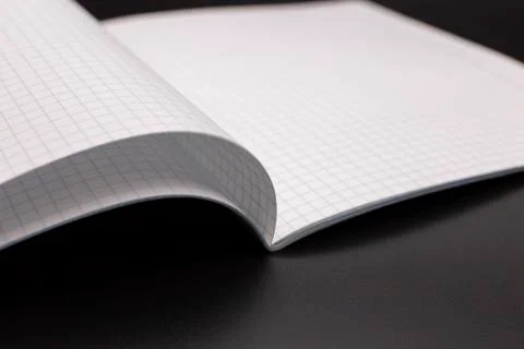 Notebook, exercise book, copybook on a dark background Stock Photos