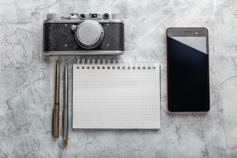 Notebook with film camera. Stock Photos