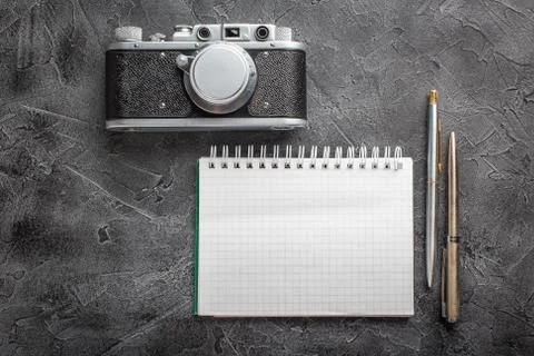 Notebook with film camera. Stock-Fotos