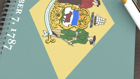 A notebook with the flag of Delaware and a lying pen Stock Footage 167828408