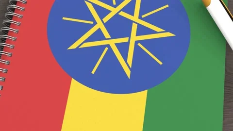 A notebook with the flag of Ethiopia and a lying pen Stock Footage 167828065