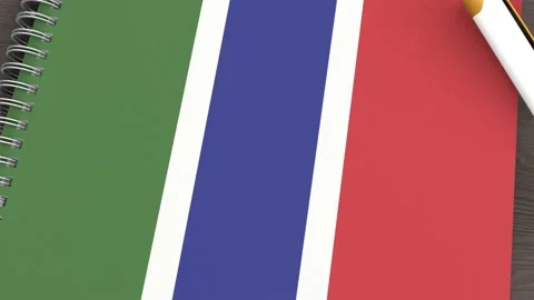 A notebook with the flag of Gambia and a lying pen Stock Footage 167828075