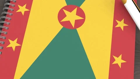 A notebook with the flag of Grenada and a lying pen Stock-Footage 167828086