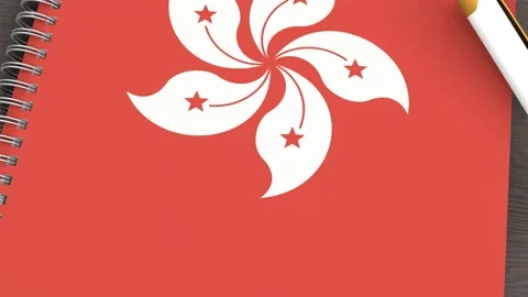 A notebook with the flag of Hong kong and a lying pen Stock Footage 167828106