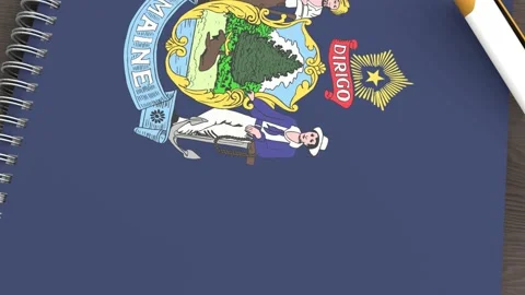 A notebook with the flag of Maine and a lying pen Video stock 167828429