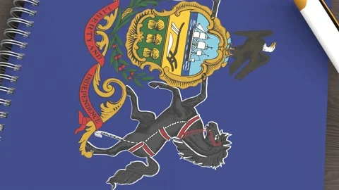 A notebook with the flag of Pennsylvania and a lying pen Stock Footage 167828463