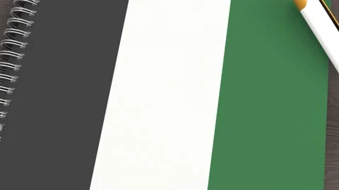 A notebook with the flag of United Arab Emirates and a lying pen Stock Footage 167828363