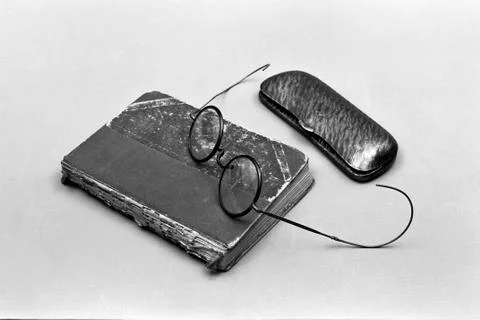 Notebook, glasses and clips Stock Photos