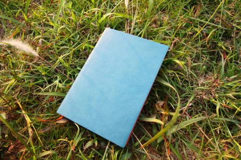 Notebook on the grasses Stock Photos