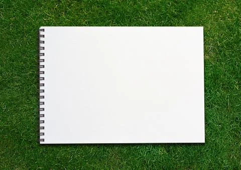 Notebook on grassland Stock Photos
