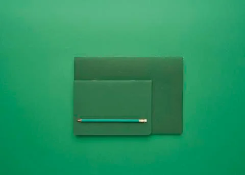 Notebook on a green background Stock Photos