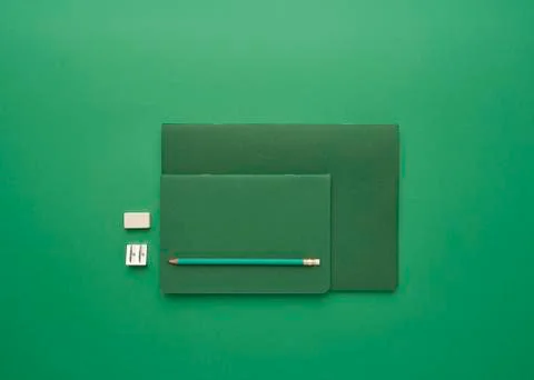 Notebook on a green background Stock Photos