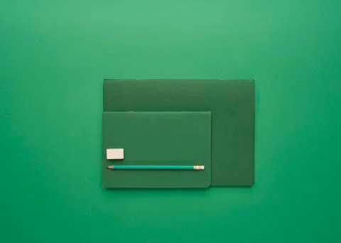 Notebook on a green background Stock Photos